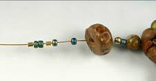 Clay and glass beads on beading wire